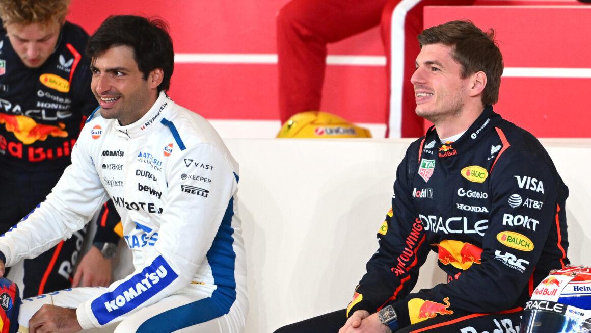 a couple of men sitting next to each other