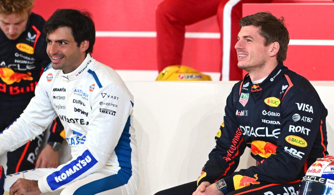 a couple of men sitting next to each other